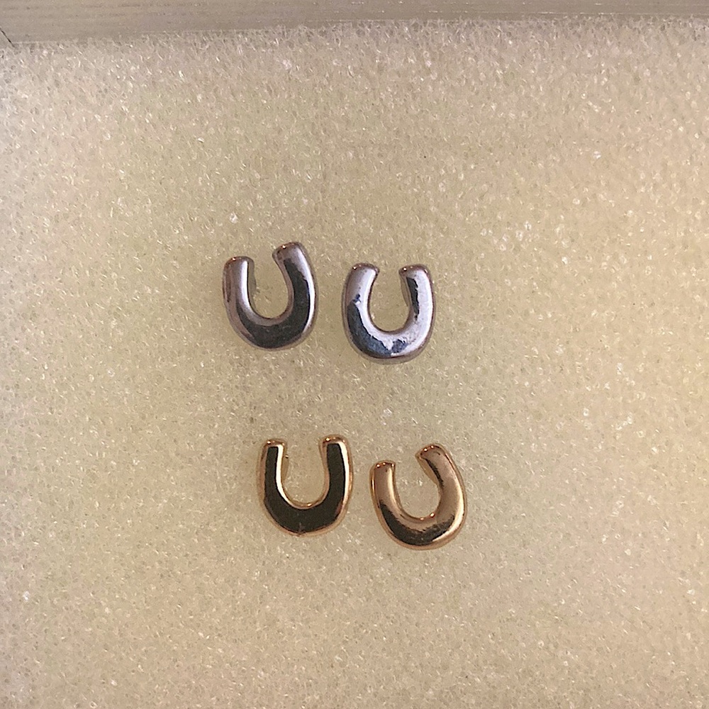 Two sets of horseshoe earrings